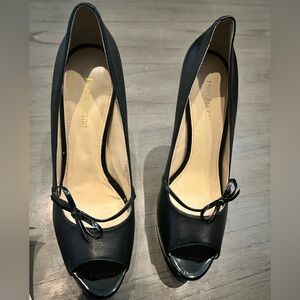 Black high heels, never worn, size 11